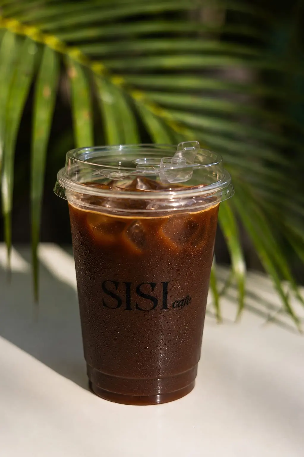 Iced americano in a SISI Cafe cup